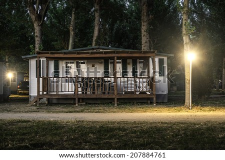 Wooden bungalow in camping at night
