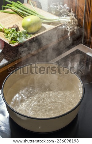 Boiling water in a saucepan. Vintage kitchen