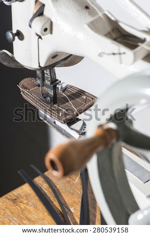 Sewing leather. Manual machine