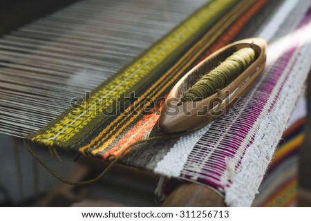 Vintage loom and yarn. Knitting carpet