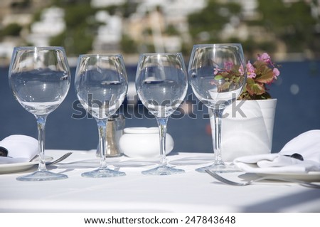 Decorated table in a restaurant outside-in the background Mediterranean sea