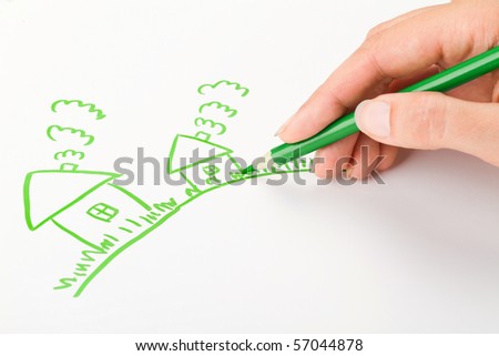 Hand drawing a house with green pen