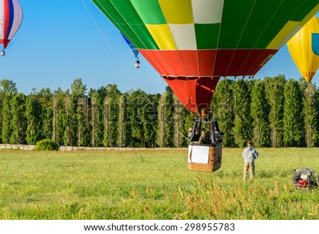 mass start of hot air  balloons, view from the ground