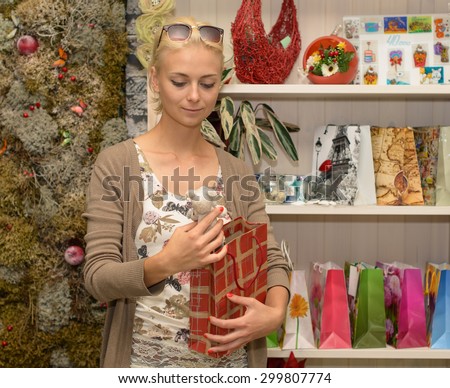 young woman in the gift shop. Focus on the face of the model on the left