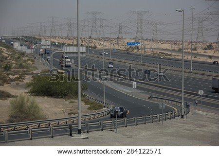 Highway interchange through the desert with trucks and cars in the United Arab Emirates