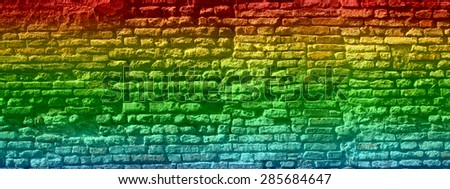 Concept or conceptual colorful painted or graffiti old vintage grungy brick wall texture or urban background, metaphor to art, city, street, artistic, creative, culture, retro, underground brickwall