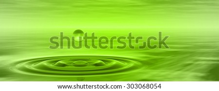 Concept or conceptual green liquid drop falling in water with ripples and waves background banner metaphor to nature, natural, summer, spa, drink, cool, business, environment, rain or health design
