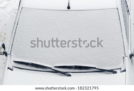 car cover after snowfall. snow surface