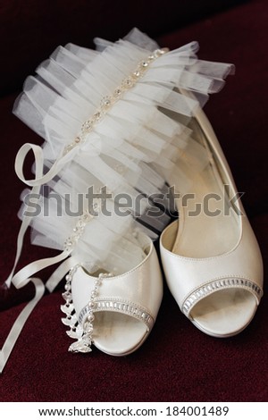 two white bride weddings easy shoes on a dark background