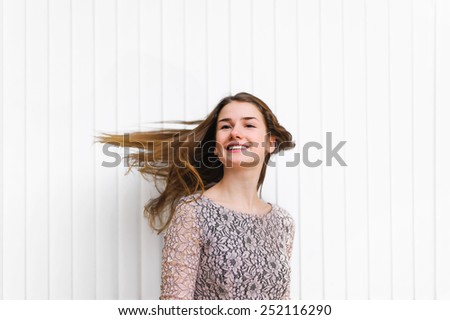 young woman\'s hair in motion. natural motion blur effect on face