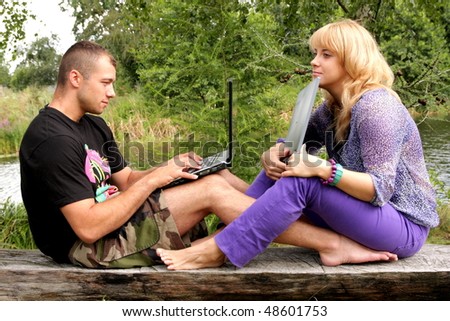 Lovers, nature, internet, notebook and computer addiction