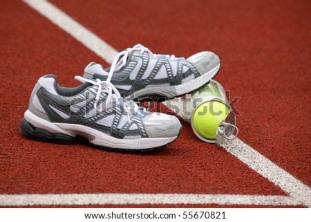 Sports shoes for tennis on court background