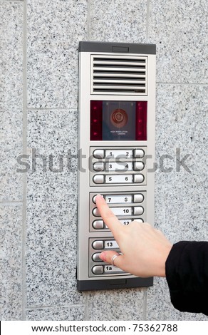Video intercom in the entry of a house and secret guest, technology and security background