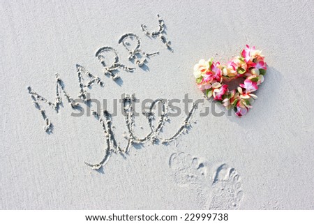 Hawaii flowers and marriage proposal sign on the beach