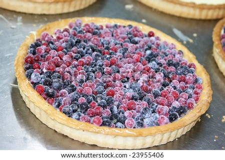 Sweet berry pie getting ready by the confectioner