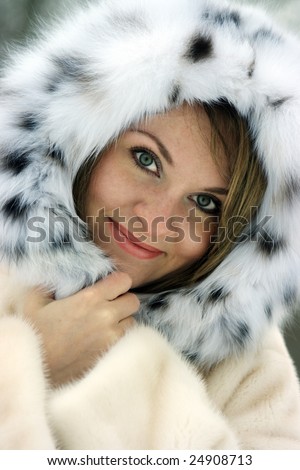 Beautiful lady in fur in the winter