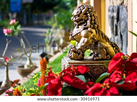 Bronze lion sculpture at the entrance to the house