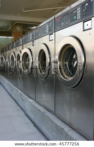 Public laundry machines standing in a row