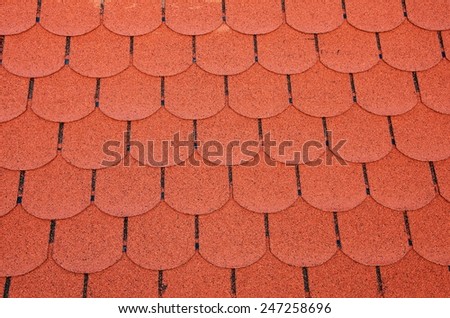 Red toned roofing shingles.