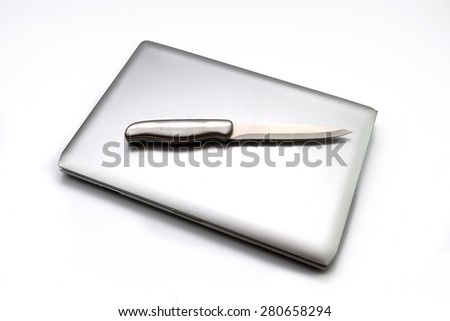 Silver knife on laptop