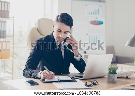 Portrait of focused confident concentrated smart intelligent clever busy expert specialist assistant giving recommendations advice to clients organizing meetings writing information to notepad