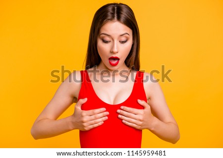 Magic pills for enlargement tits helped me! Wow omg! Close up photo portrait of impressed crazy beautiful nice funny funky lady touching breast isolated on vivid background