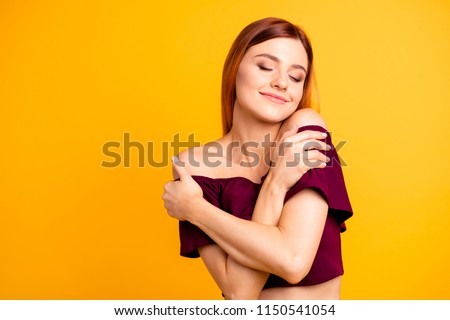 Close up photo portrait of attractive person lady with satisfied emotion facial expression hugging herself wearing maroon colorful clothing isolated on bright background copyspace