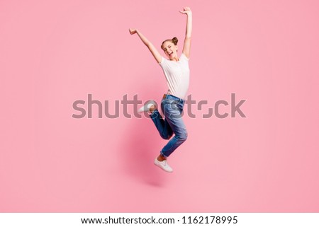 Finally summer vacation! Full legs, body, size portrait of happy girl who jumps up high lifting hands isolated on bright pink background