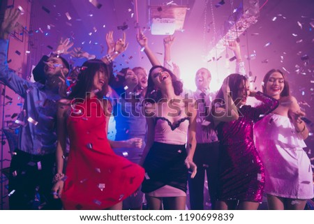 Sequins fall from violet ceiling, ecstatic, positivity, happiness, emotion, excited, rejoice persons dance make big toothy smile, raised hands up