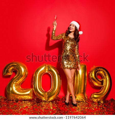 Full length, legs, body, size portrait of lady on sharp, pumps, stilettos, with modern wave hairdo isolated on vivid red background raised up glass with beverage, look aside make big toothy smile