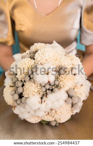 closeup image of stylish bridal bouquet. bridal bouquet of flowers from the bark of Sola, cotton and brunei