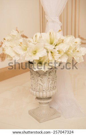 closeup image of stylish bridal bouquet on the green grass. bridal bouquet of flowers from the bark of Sola, cotton and brunei