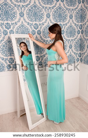 beautiful girl standing near mirror