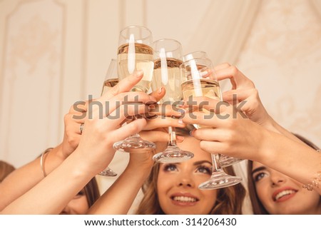 Cheers! girls celebrate a bachelorette party of bride.