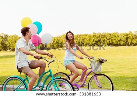 happy couple together to ride a bicycle