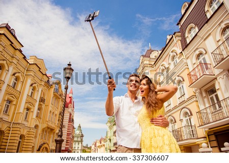 couple in love making selfie photo on self stick
