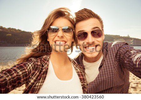 Two lovers making funny selfie