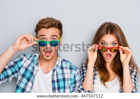 Wow! Surprised man and woman in glasses with open mouth