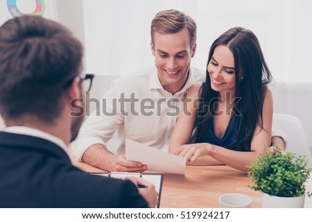 Successful lawyer giving consultation to family couple about buying house