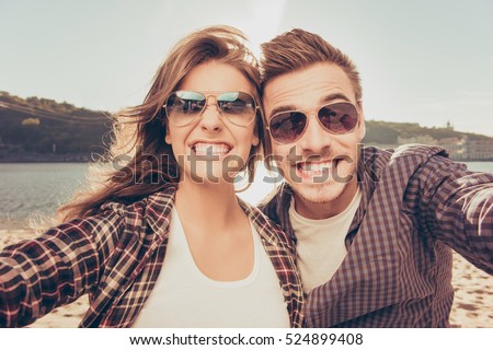 Two lovers making funny selfie