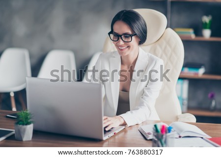 beautiful clever cute charming attractive elegant owner of big company has online meeting with international business partners, she is sitting at the table at workstation