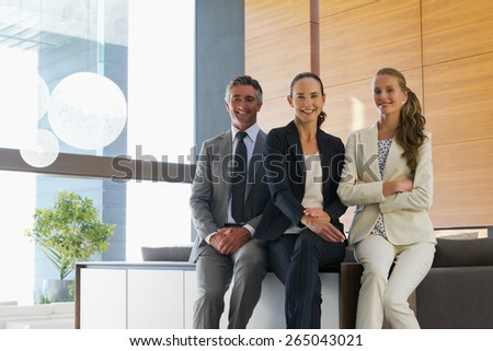 Business team of tree smiling executives. Portrait.