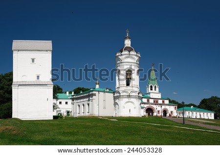Moscow, Russia - July 8, 2012: Temple belfry George the Victorious and water tower in the museum estate Kolomenskoye, landmark, people walking in the park