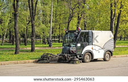 Moscow, Russia - May 3, 2014: Sweeper cleans the City Park on Poklonnaya Hill