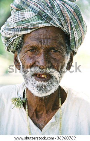 CHOLISTAN, PAKISTAN – JUNE 5: An unidentified farmer poses for a portrait as he rests after hard work in the fields June 5, 2007 in Cholistan, Pakistan.