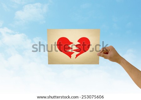 paper in man hand in heartbroken on natural background There is space for you to add your text.