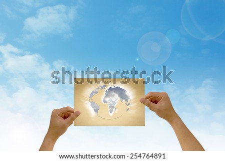 paper in man hand have the world map on natural background There is space for you to add your text.