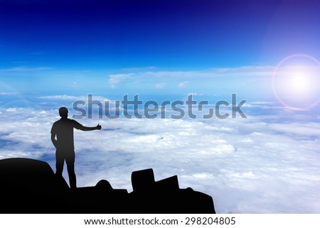 Silhouette of the real friend on the peak of mountain.Everyone need real friends