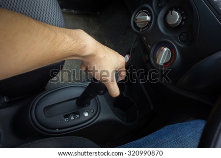 man hand turn signal switch. Car interior detail.