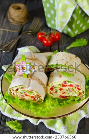 Rolls of bread with vegetables, cheese and sausage. Sandwiches for the picnic